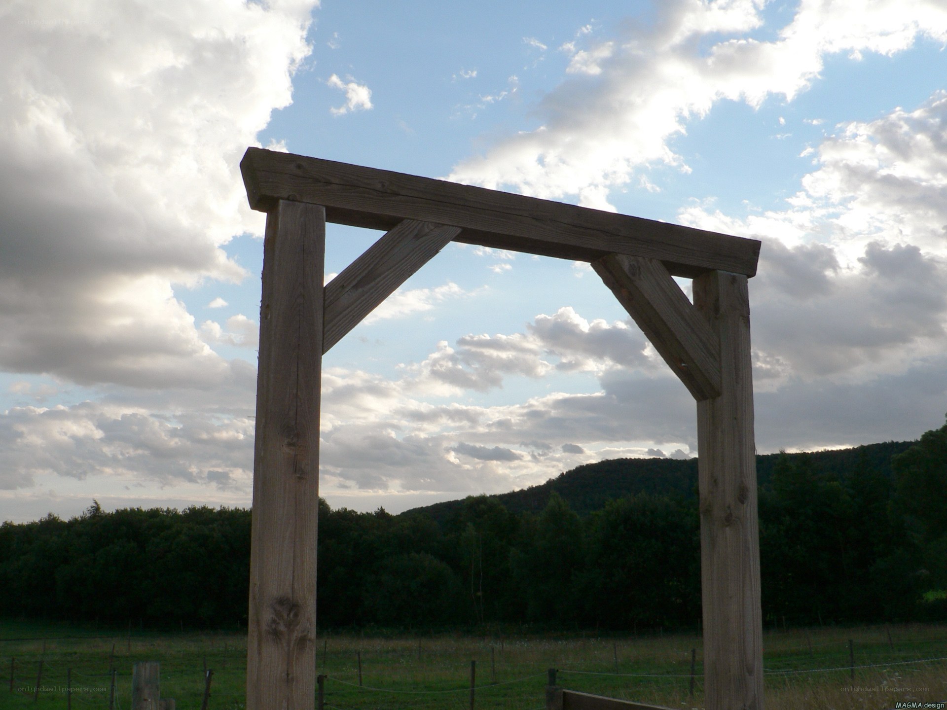 Wooden arch in a field