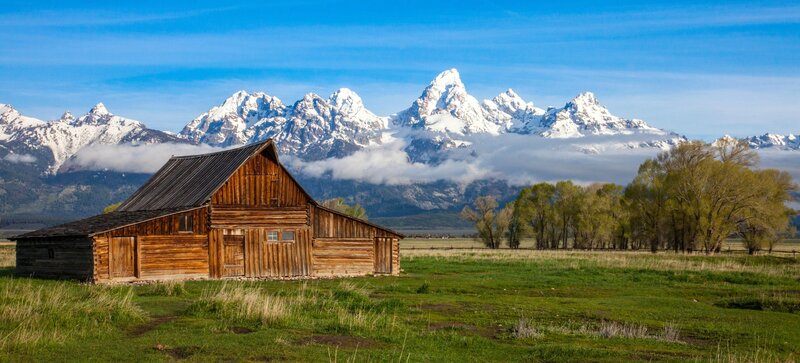 Wooden Barn in Field — Green, Serene, Spring, Photograph