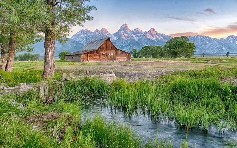Wooden Barn in Field — Green, Serene, Sunset