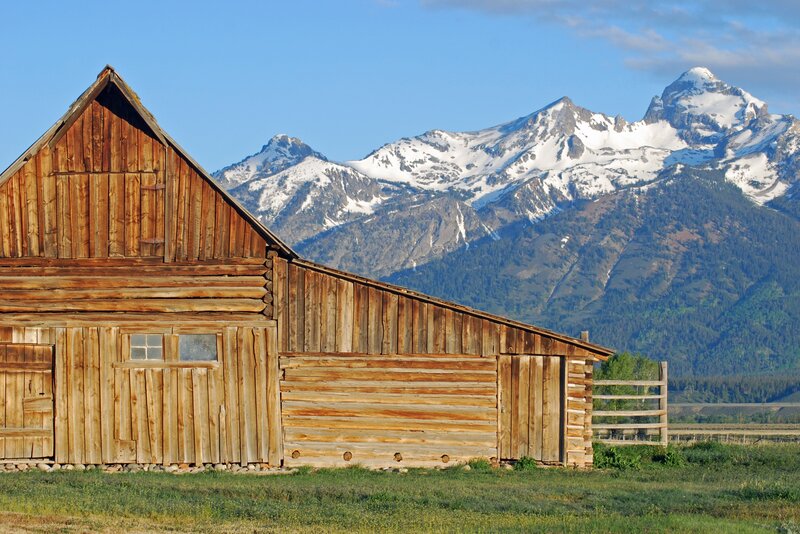 Wooden Barn with Mountains