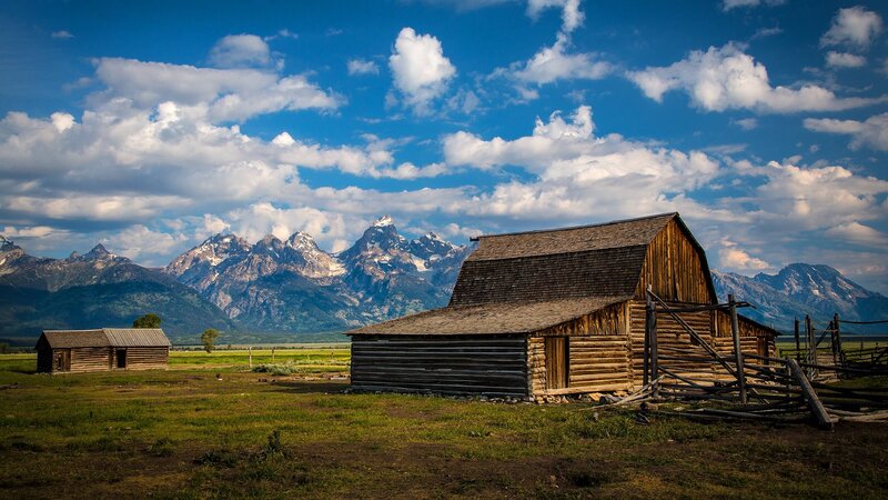 Wooden Barns in Field