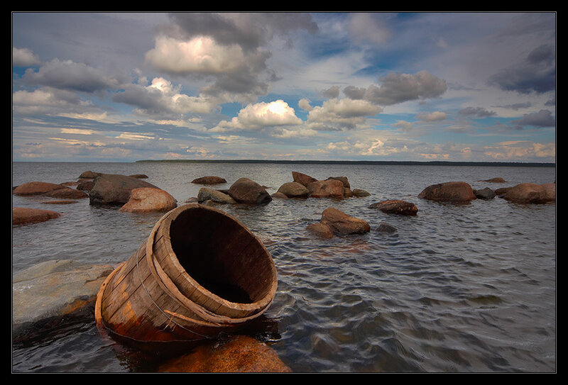 Wooden barrel on a rocky shore