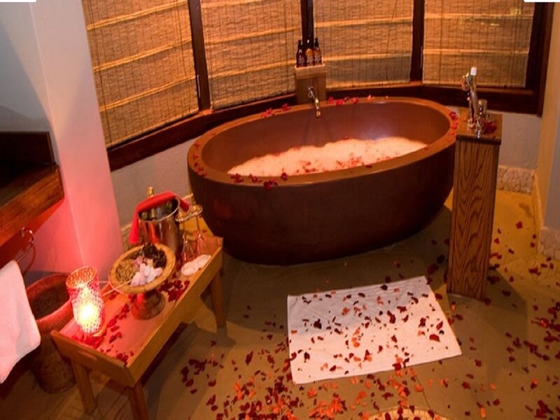 Wooden Bathtub with Rose Petals