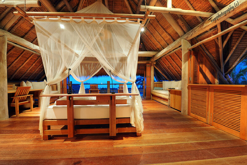 wooden bedroom with canopy bed
