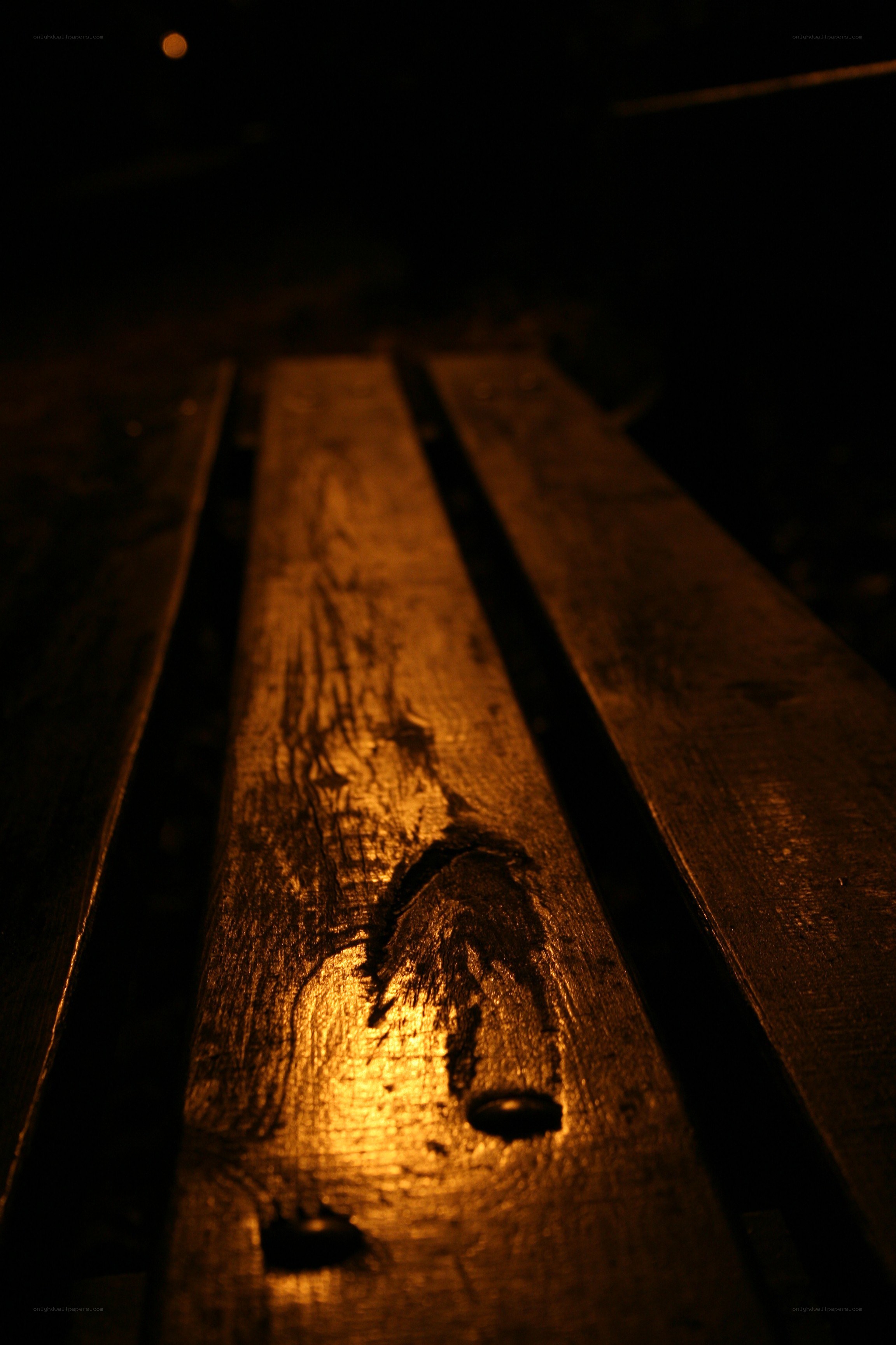 wooden bench at night