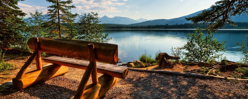 Wooden bench by a lake