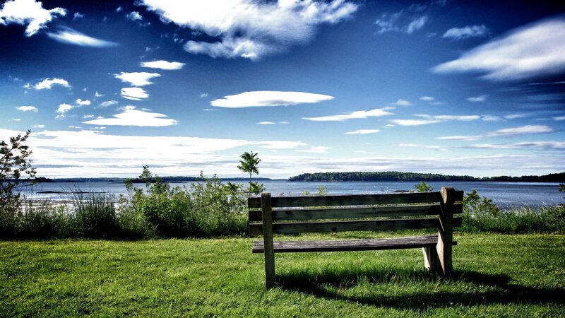 Wooden bench by the water