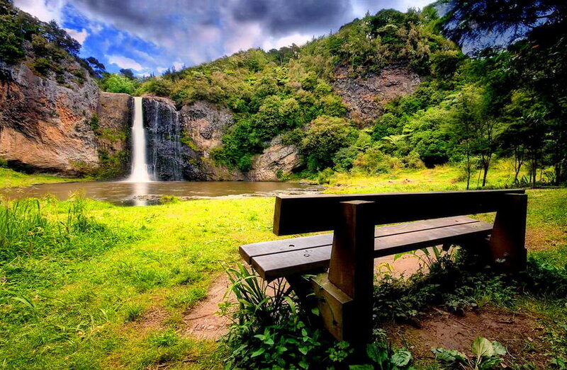 Wooden Bench by Waterfall — Green, Serene, Afternoon, Photograph