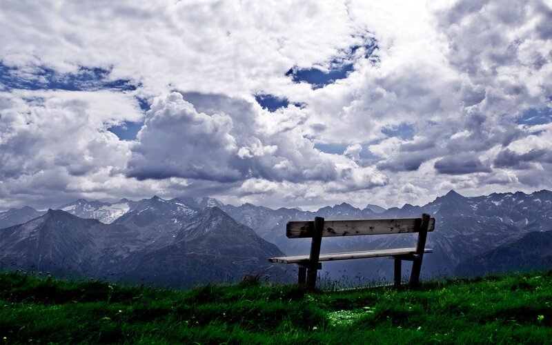 Wooden Bench in Mountains — Green, Dramatic, Afternoon, Photograph, Clouds, Grass, Blue