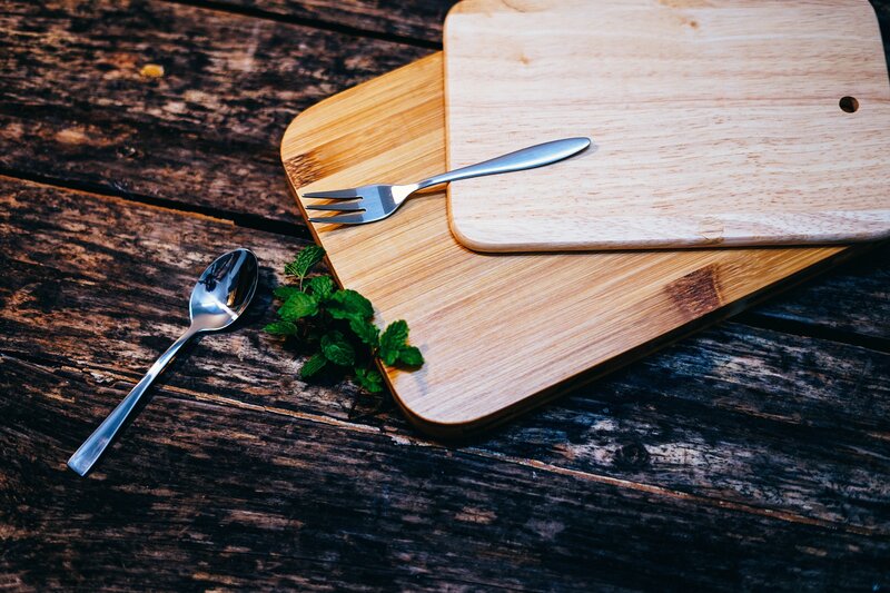 Wooden boards with cutlery