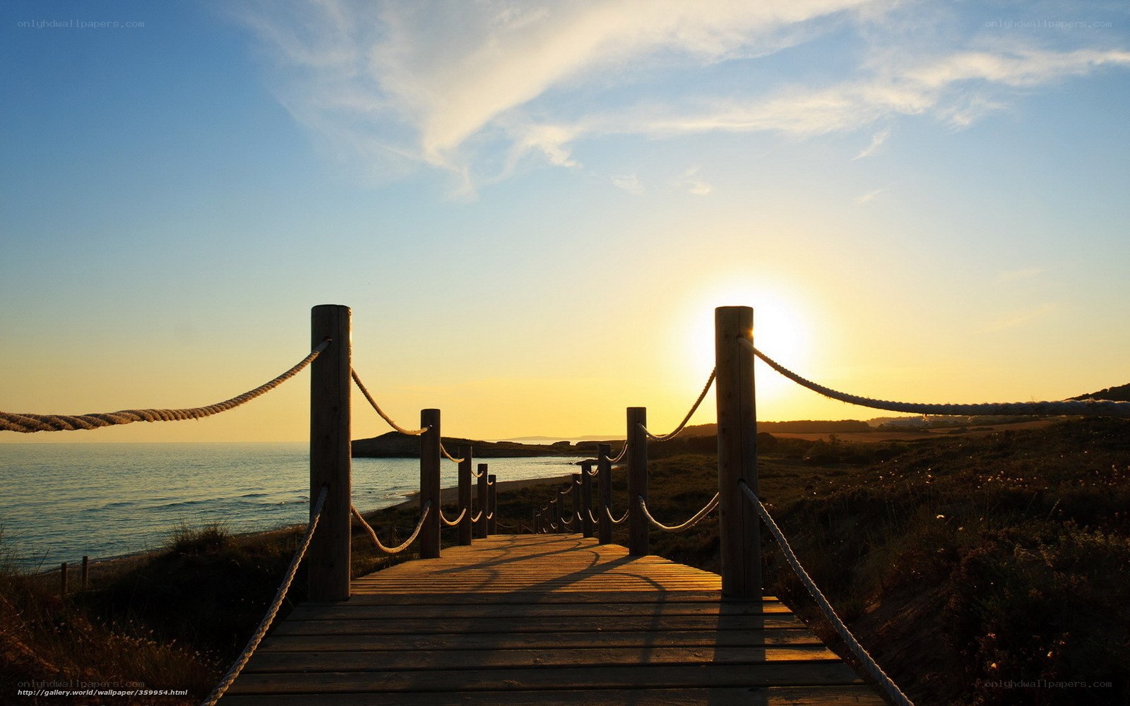 Wooden boardwalk at sunset