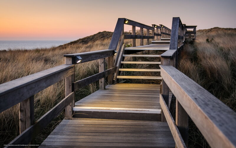 Wooden boardwalk at sunset