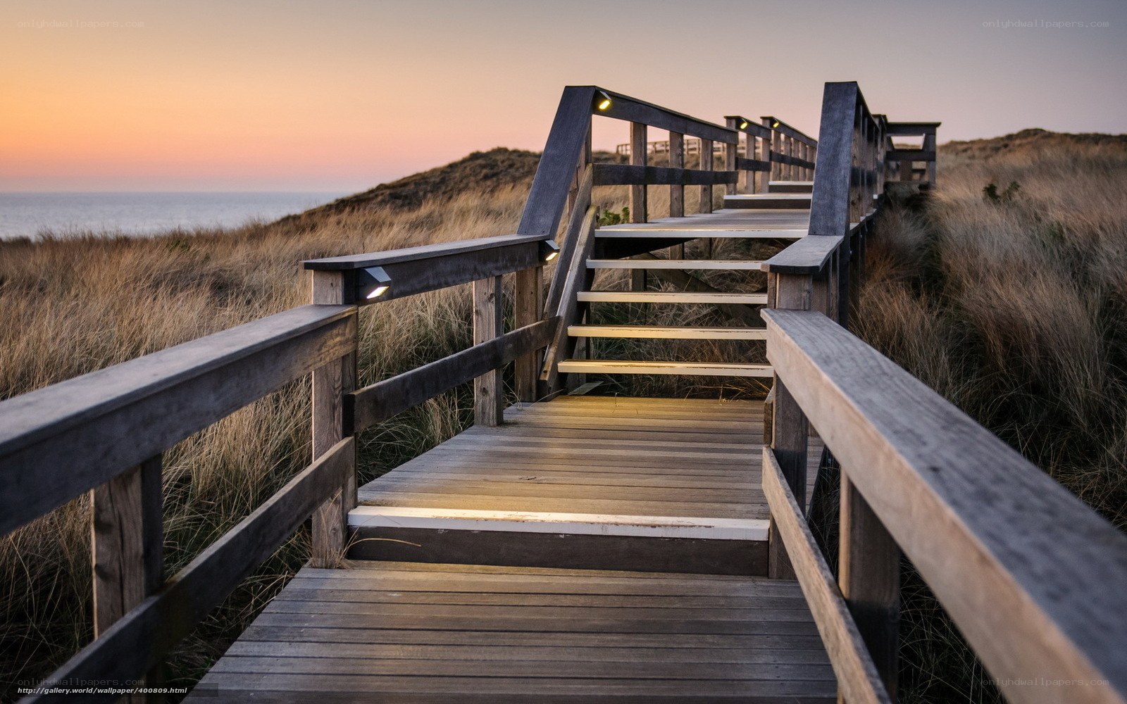 Wooden boardwalk at sunset