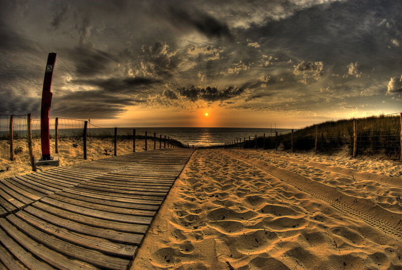 Wooden boardwalk at sunset