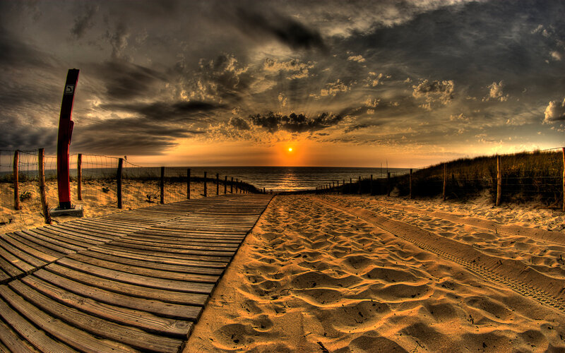 Wooden boardwalk at sunset