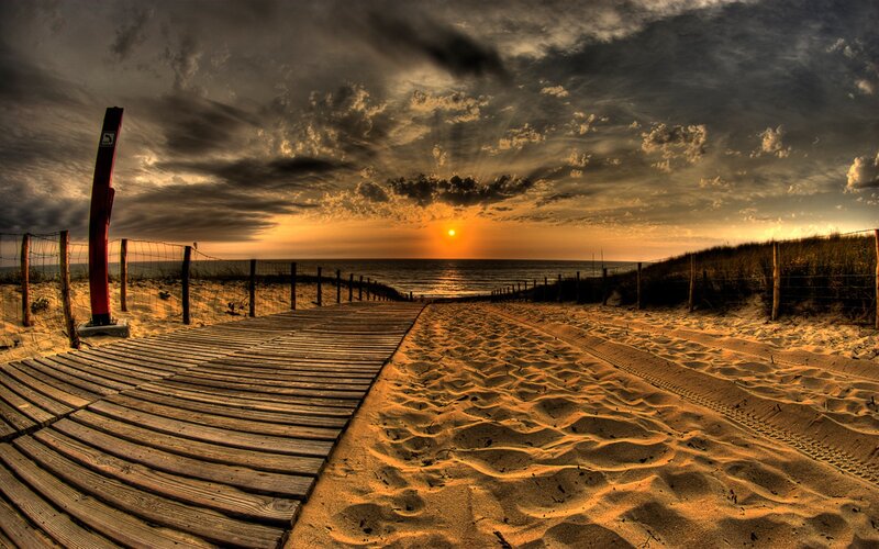 Wooden boardwalk at sunset