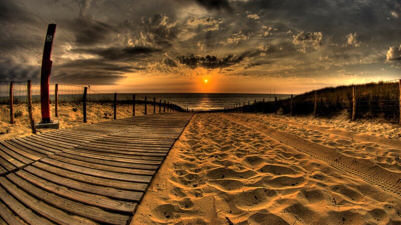 Wooden boardwalk at sunset