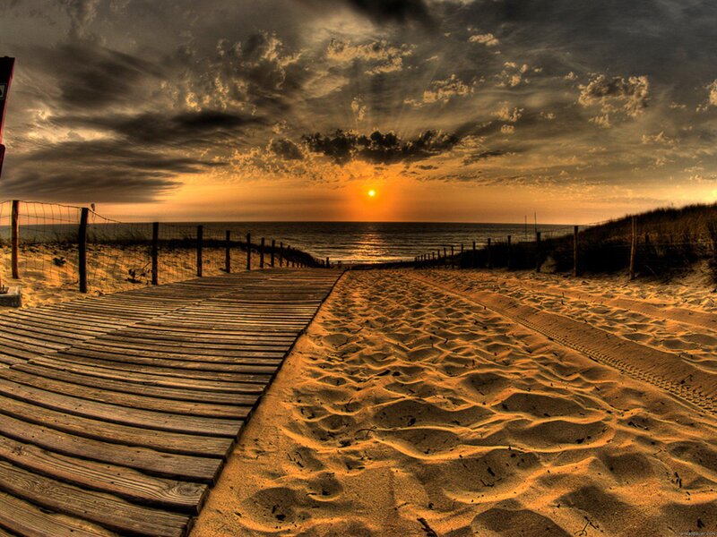 Wooden boardwalk at sunset