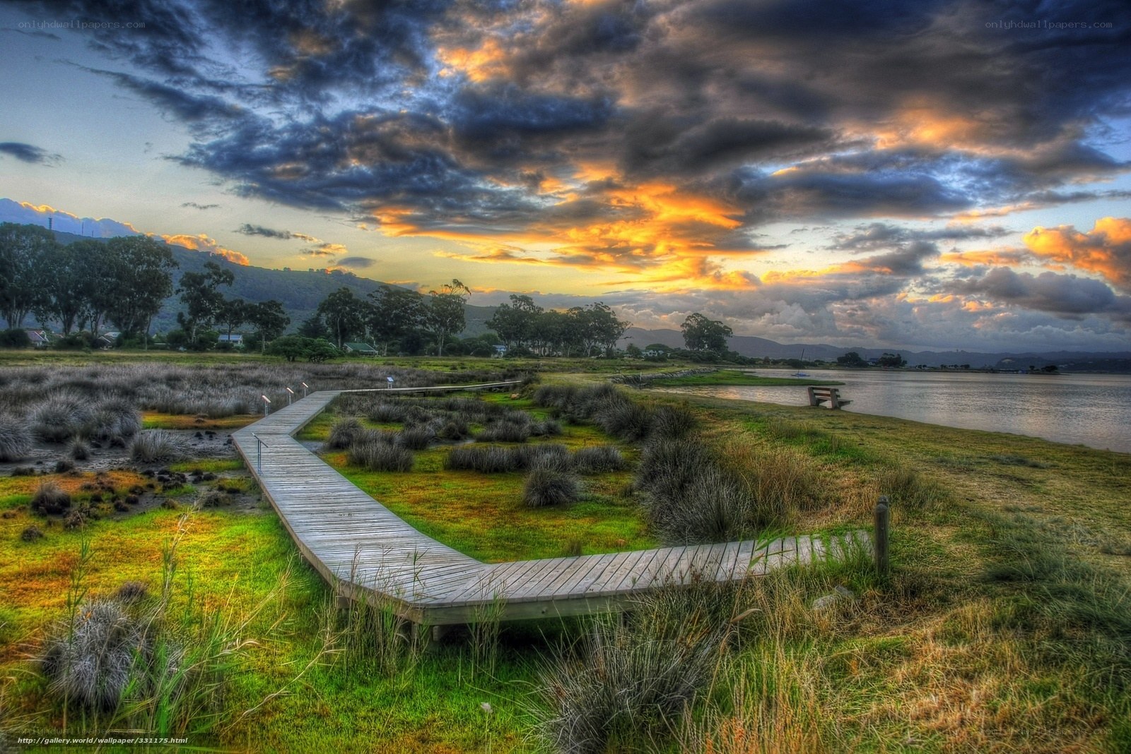 Wooden boardwalk at sunset