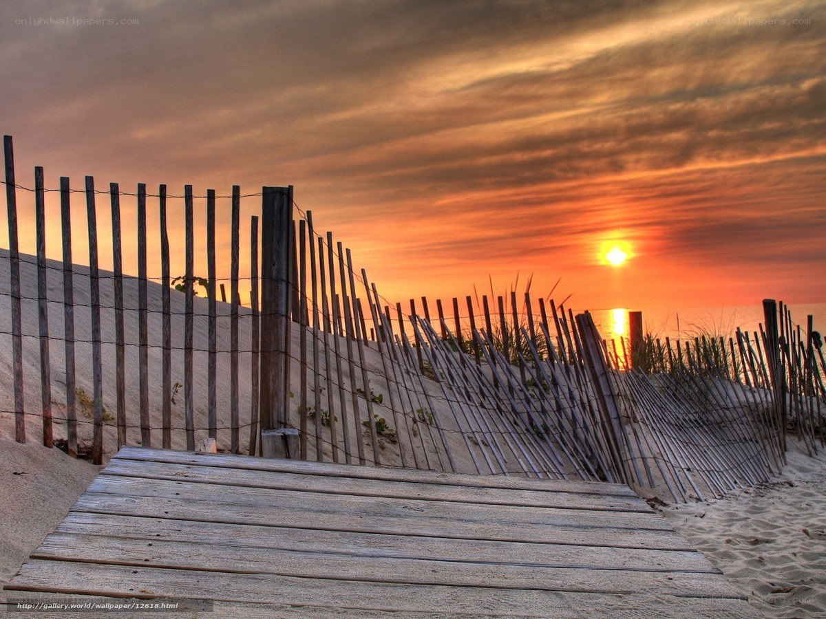 Wooden boardwalk at sunset