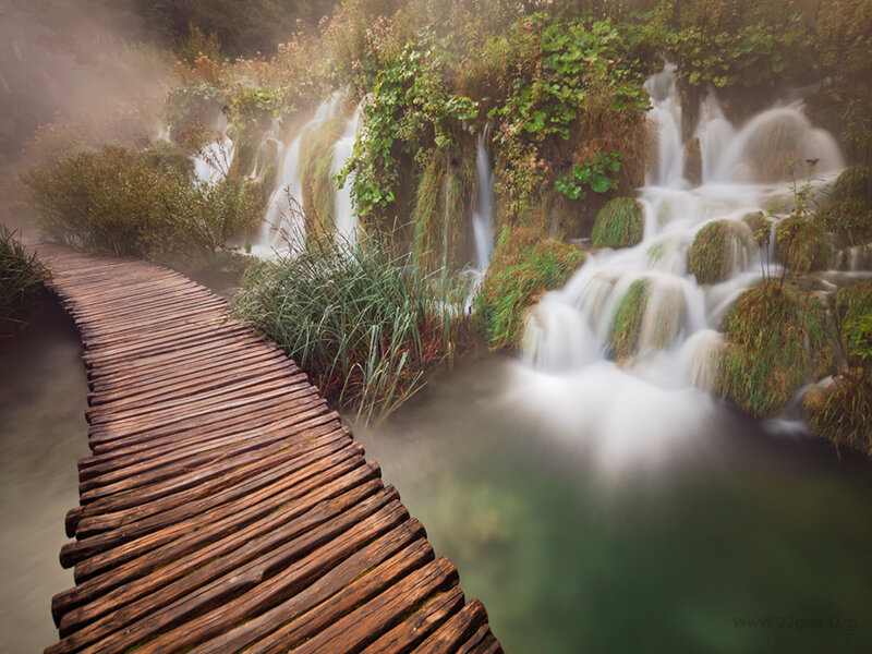 Wooden Boardwalk by Waterfall