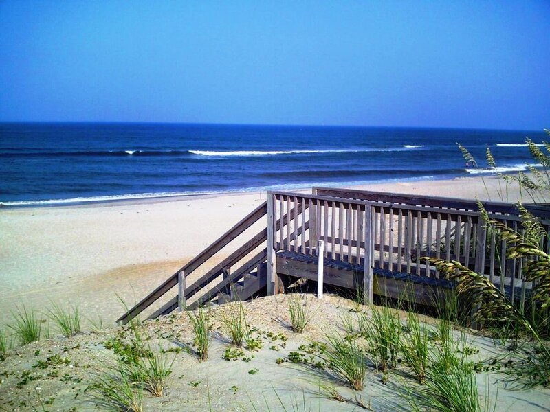 Wooden boardwalk to sandy beach