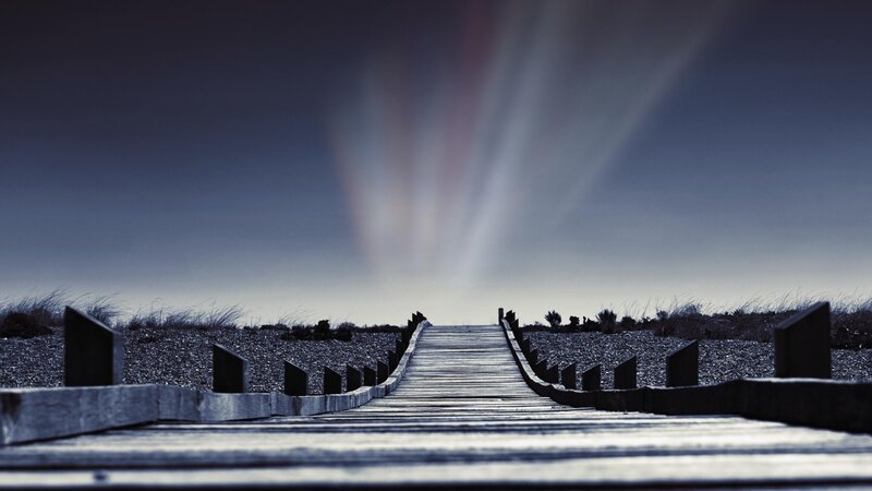 Wooden boardwalk to the horizon