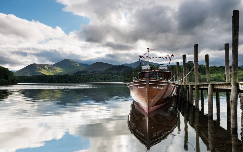 Wooden boat at a lakeside dock