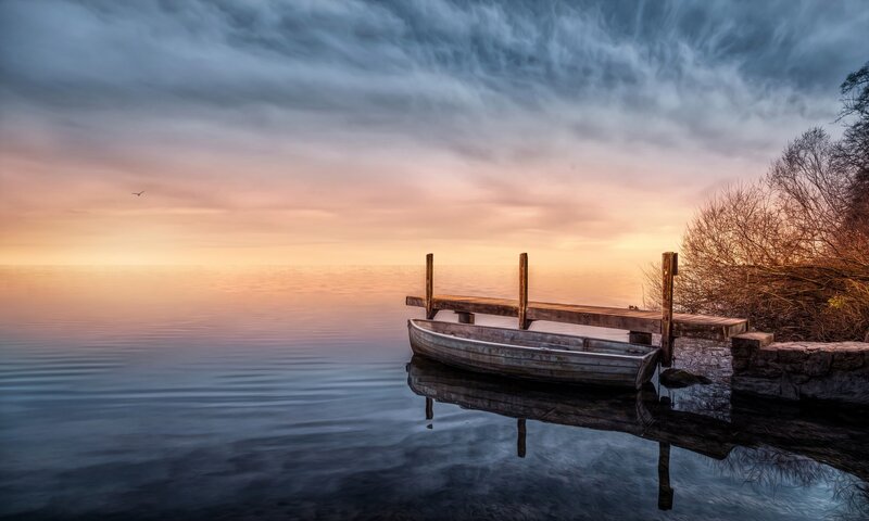 Wooden Boat at Dock — Blue, Serene, Sunset, Photograph