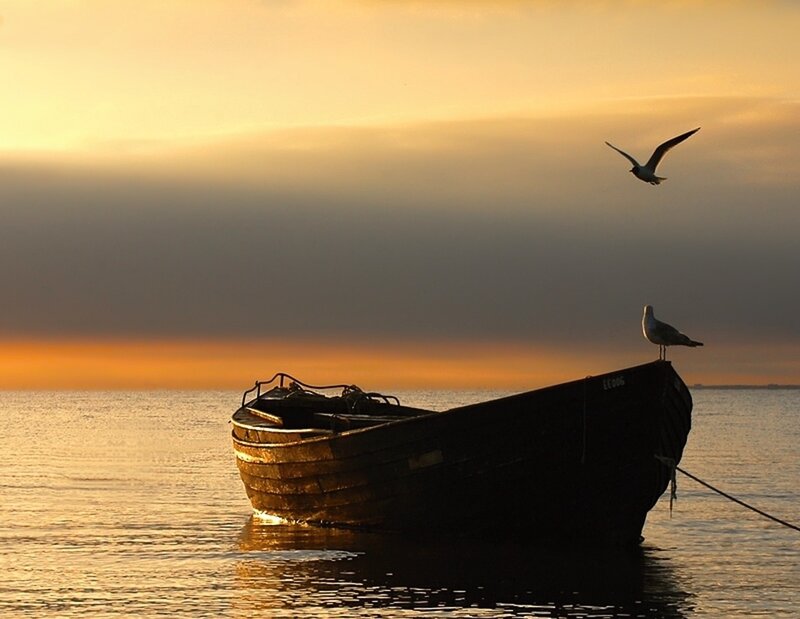 Wooden Boat at Sunset — Orange, Serene