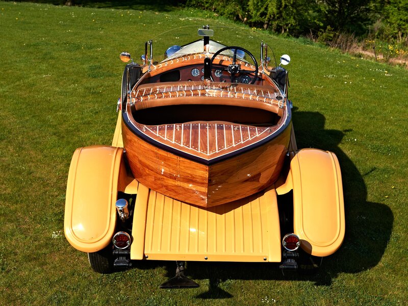 wooden boat car on grass