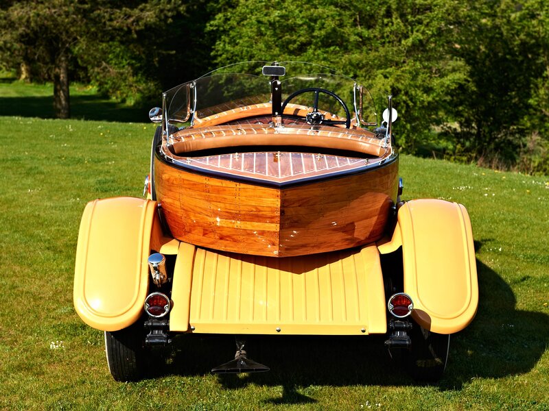 wooden boat car on grass