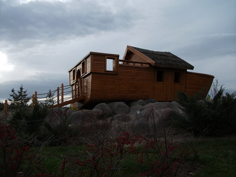 wooden boat house on rocks