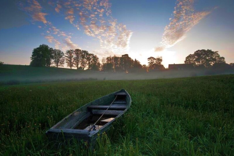 Wooden Boat in Field