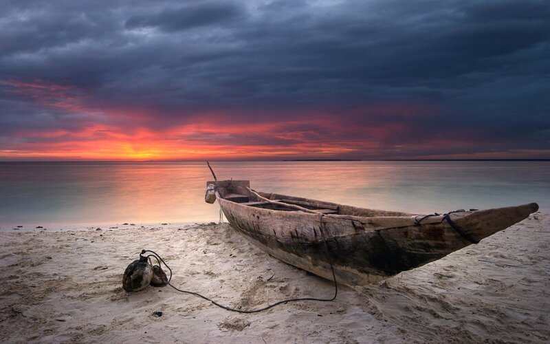Wooden Boat on Beach — Orange, Dramatic, Sunset, Photograph