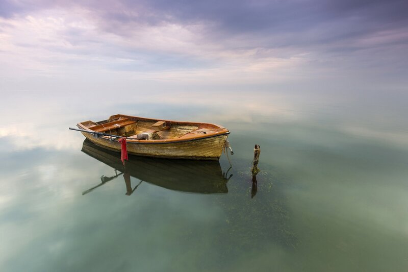 Wooden Boat on Calm Water — Blue