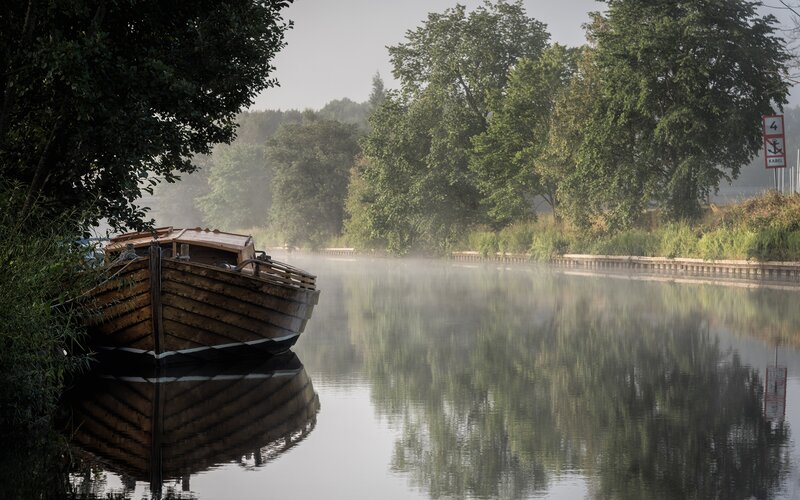 Wooden Boat on Canal — Green, Serene, Morning