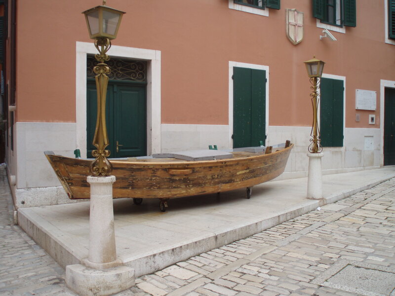 Wooden boat on display in town square