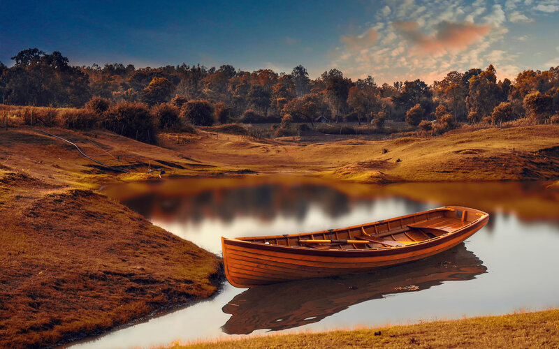 Wooden Boat on Lake — Brown, Serene, Sunset, Photograph