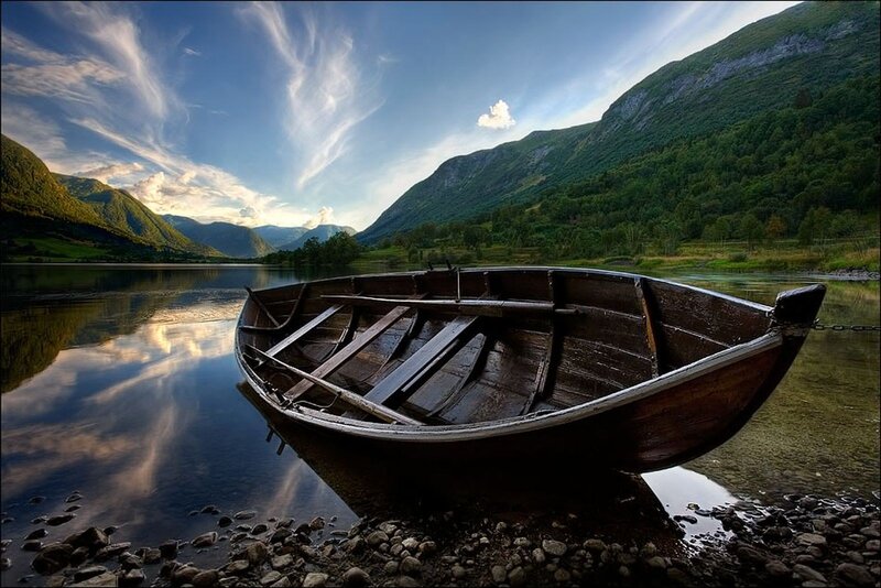 Wooden Boat on Shore — Blue, Serene, Sunset, Photograph, Lake, Mountains