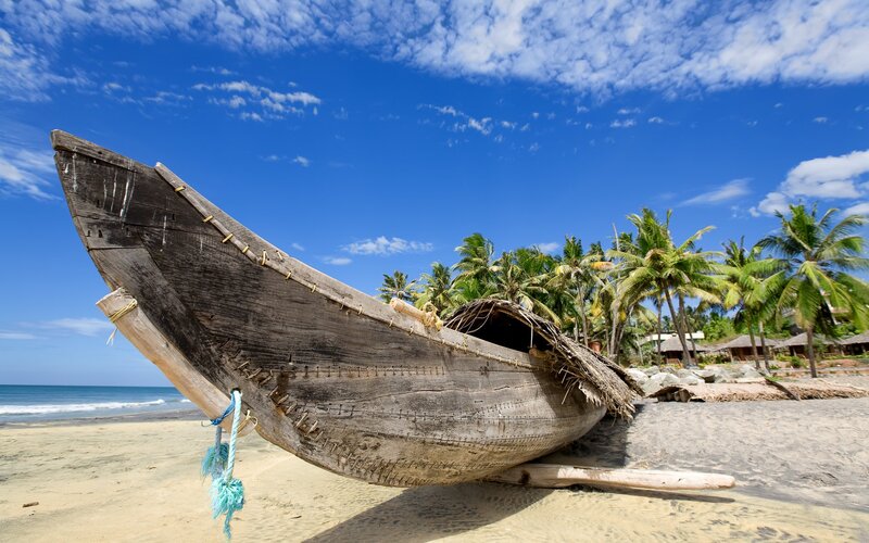 Wooden boat on tropical beach