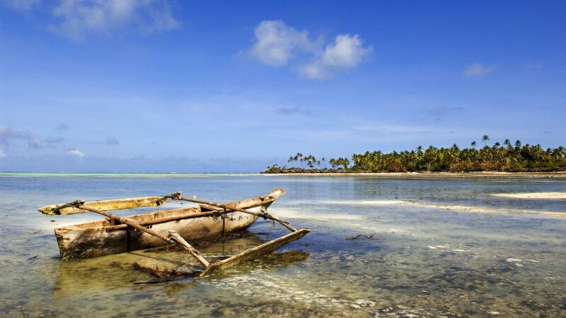 Wooden boat on tropical shore