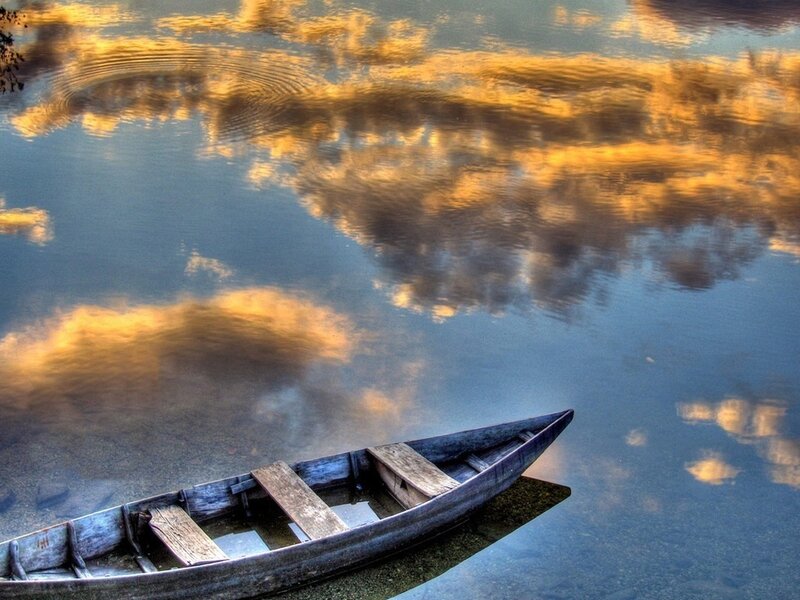 Wooden Boat on Water — Blue