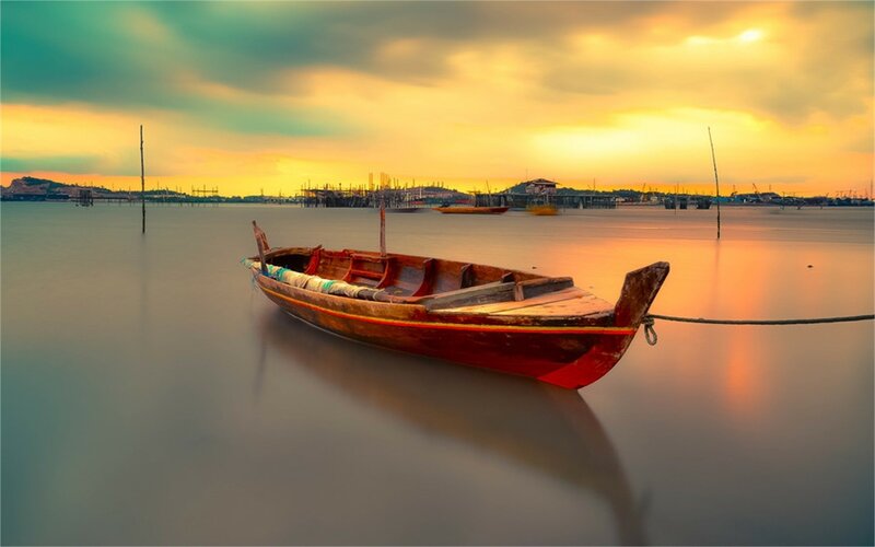 Wooden Boat on Water — Orange, Serene, Sunset, Photograph, Sky