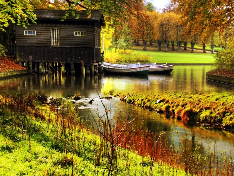 Wooden Boathouse by River — Green, Serene