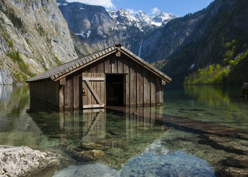 Wooden boathouse on a clear lake