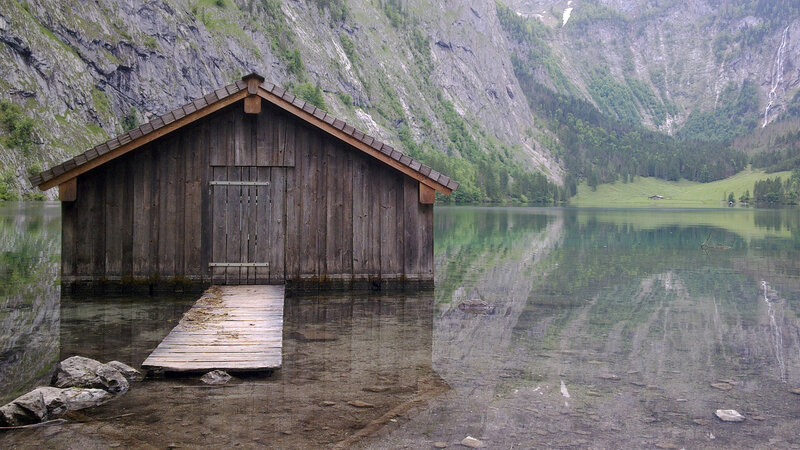 Wooden boathouse on a mountain lake