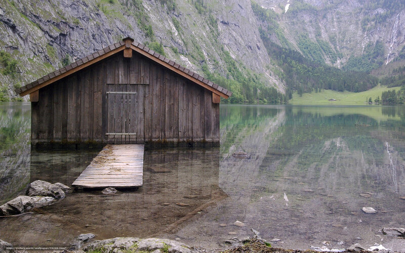 Wooden boathouse on a mountain lake