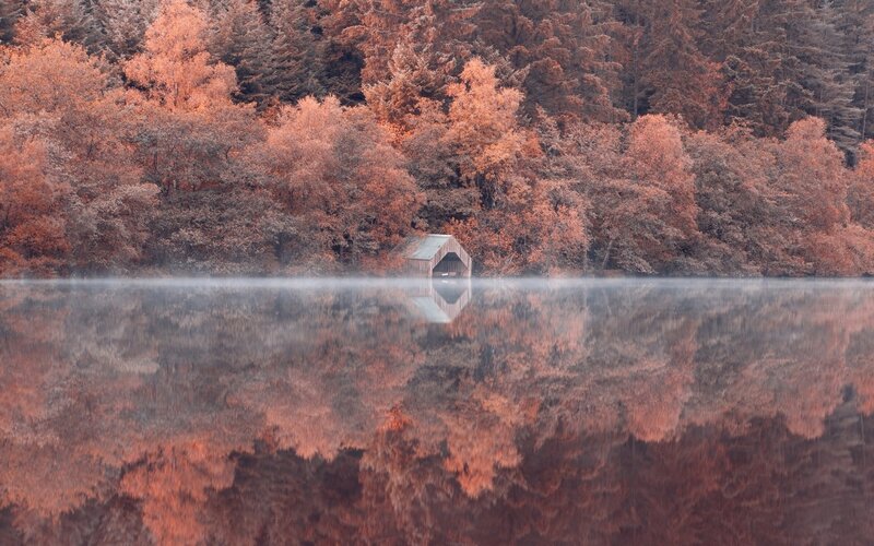 Wooden Boathouse on Lake — Orange, Serene, Autumn