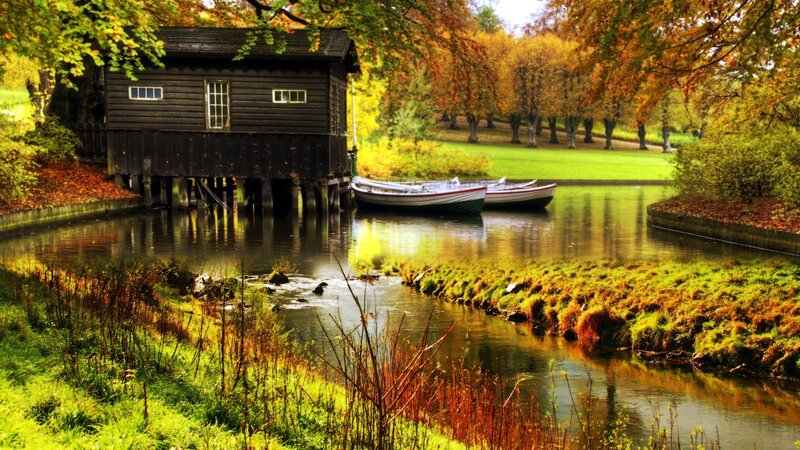 Wooden Boathouse on River — Green